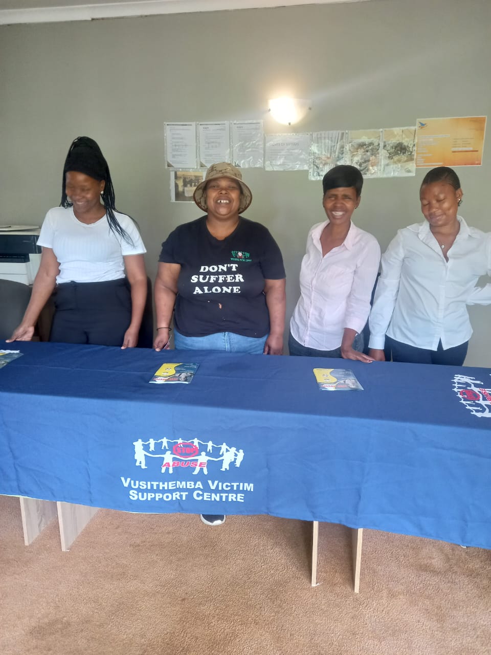 Vusithemba team standing behind an information desk