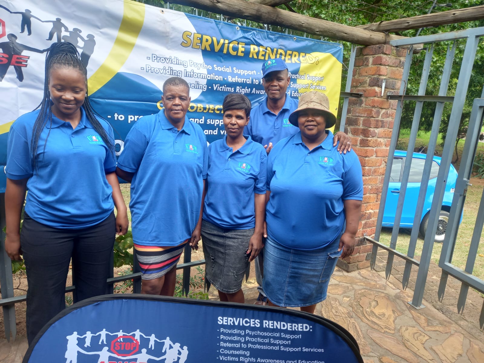 Vusithemba outreach team standing at a community support display